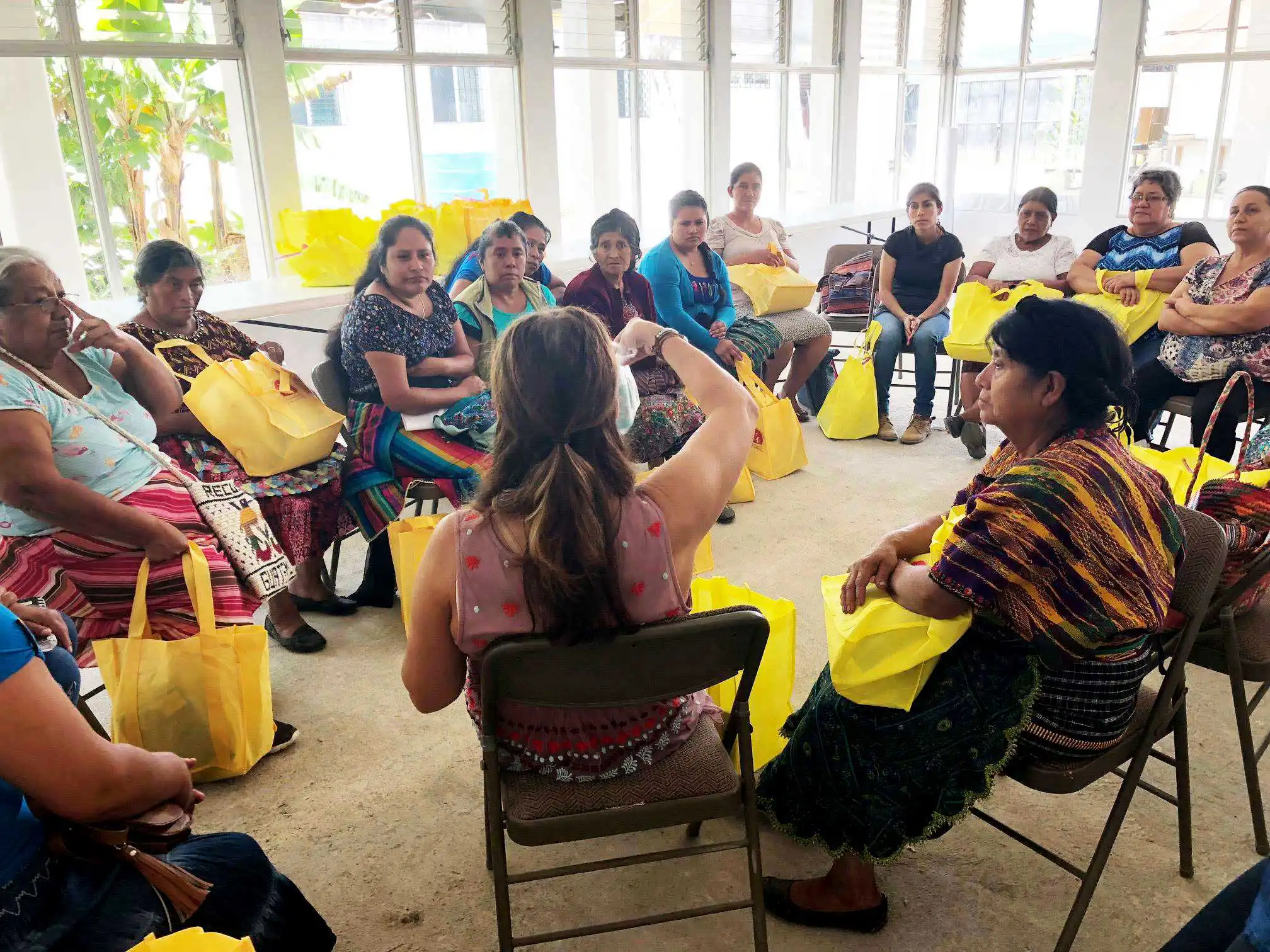 Kimberly Garcia sits in a teaching circle with midwives