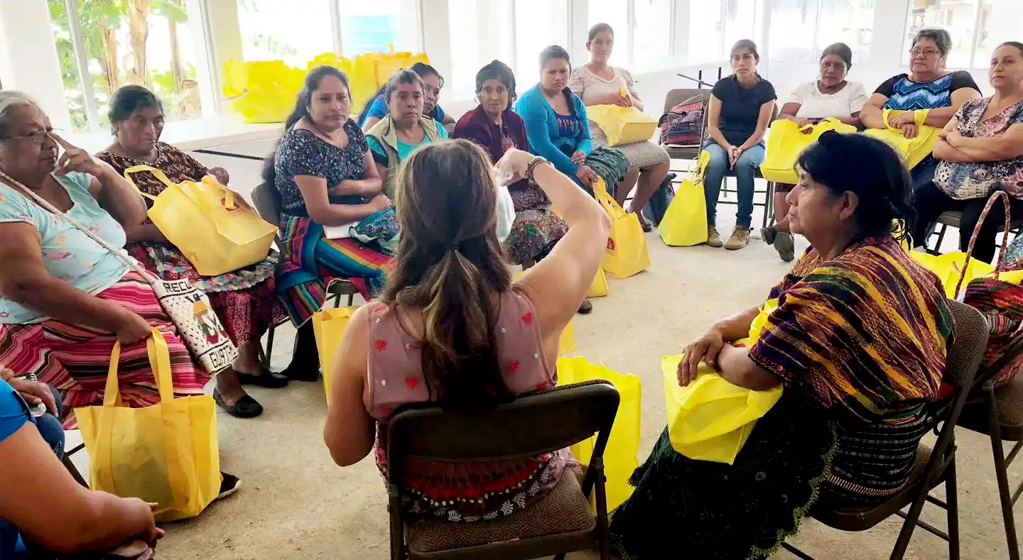 Kimberly Garcia sits in a teaching circle with midwives